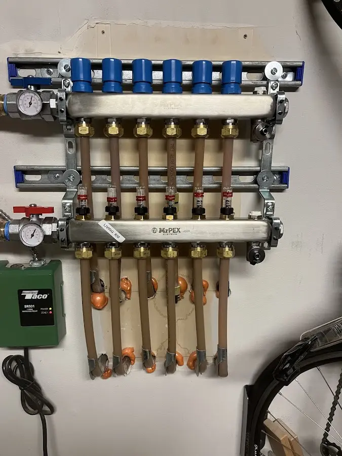 Plumber performing Water Heater Repair at a residential property in Evesham